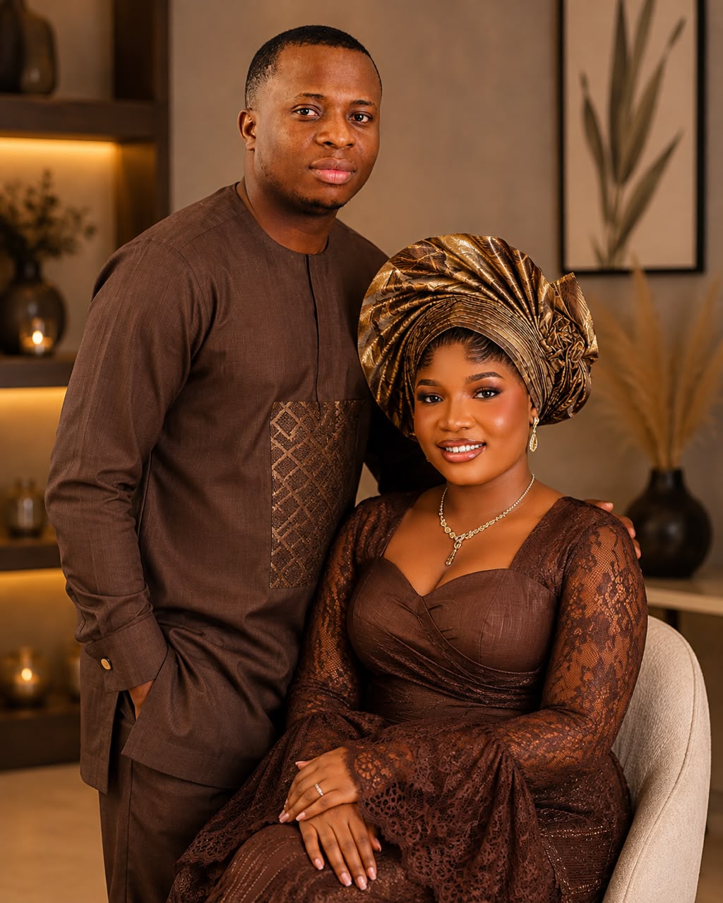 Olaniyi standing beside Esther in their beautiful coordinated brown traditional outfits